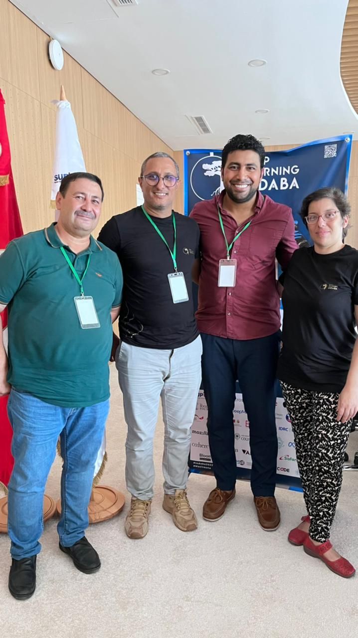 Ibrahim Mahgoub with fellow attendees at the 2022 Deep Learning Indaba event.