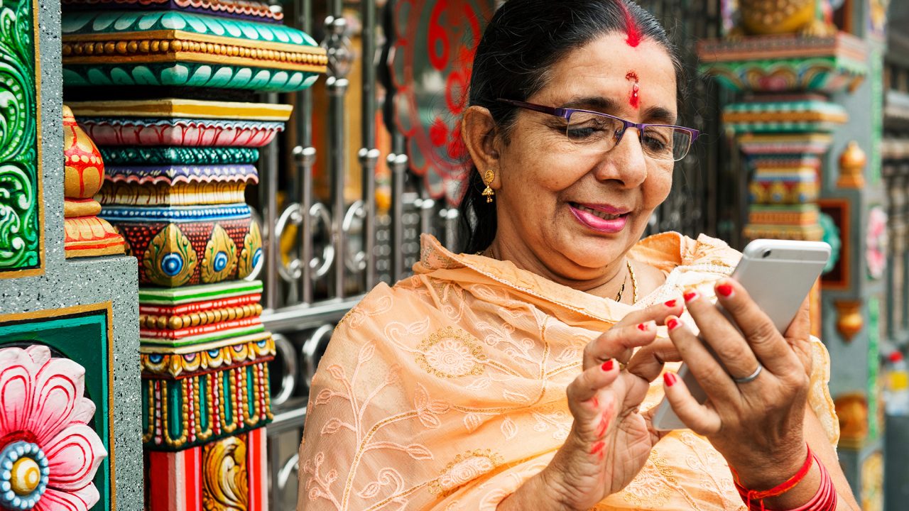 An Indian woman using a cellphone.